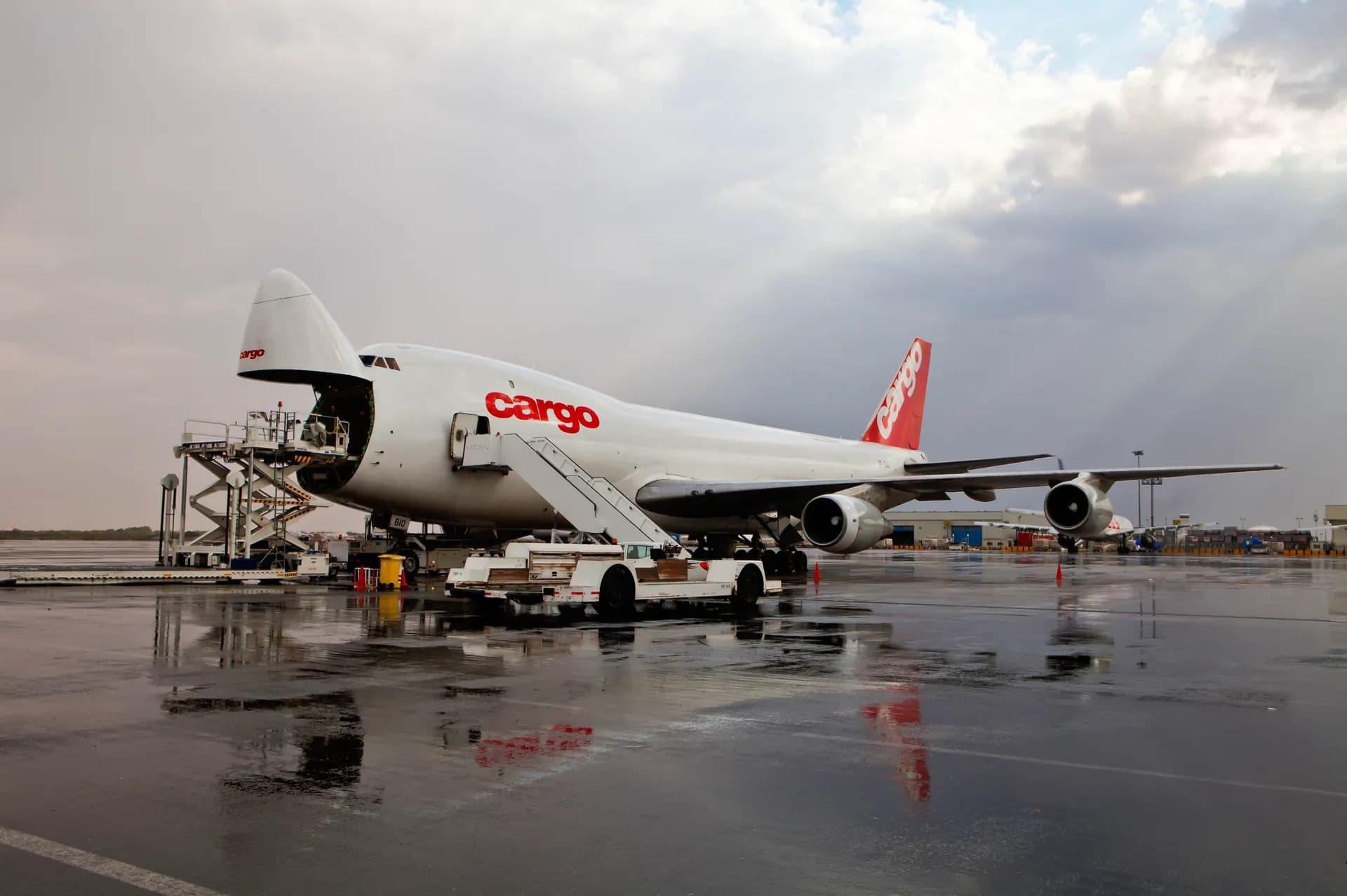 Cargo aircraft being loaded on the apron